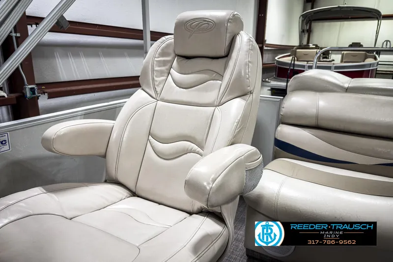 Slide: The Image of Luxurious seating on 2006 Crest Caribbean 2570 boat, featuring plush beige upholstery. - 30