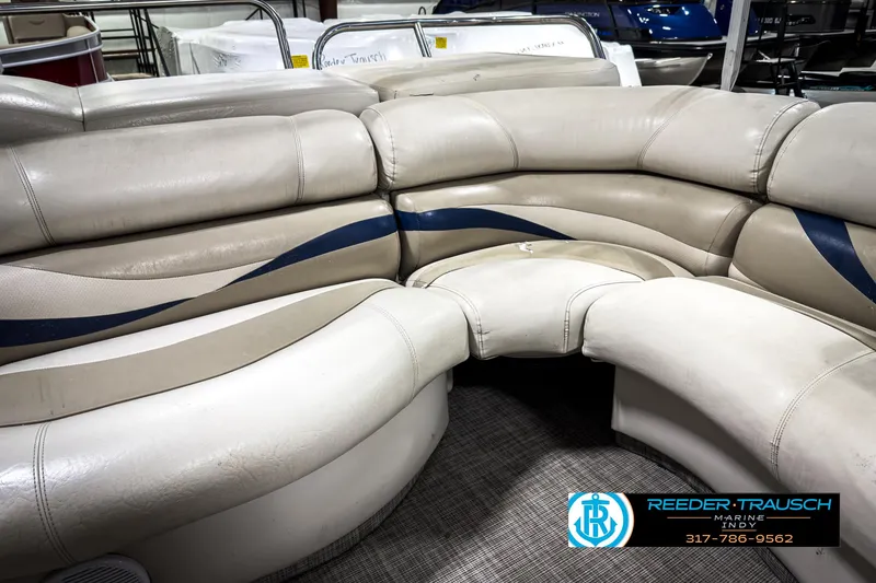 Slide: The Image of 2006 Crest Caribbean 2570 boat interior with beige and blue seating. - 32