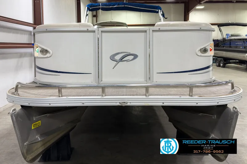 Slide: The Image of 2006 Crest Caribbean 2570 pontoon boat in indoor storage facility. - 8