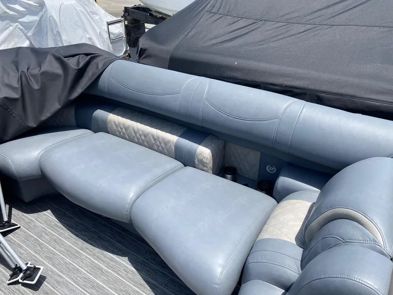 Slide: The Image of Luxurious seating on 2022 Premier 250 Grand Majestic RF boat, featuring plush gray upholstery. - 5