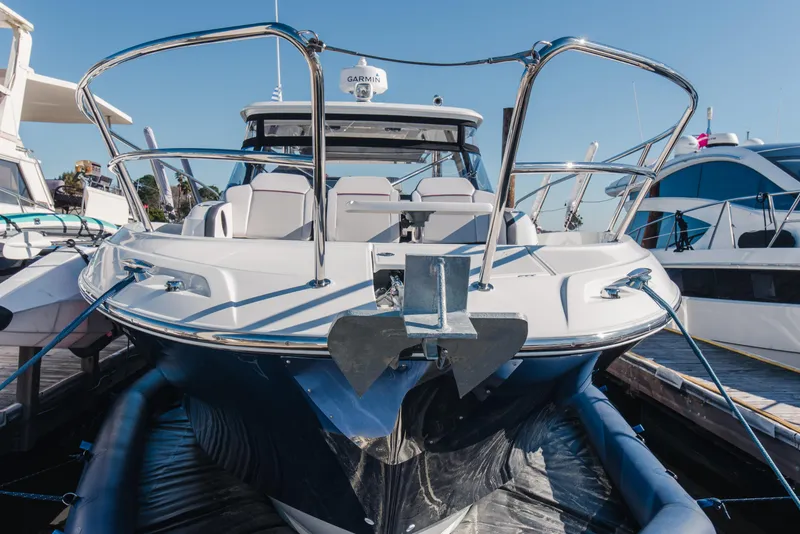 Slide: The Image of 2021 Jeanneau Leader 12.5 WA boat docked, showcasing sleek design and modern features. - 13
