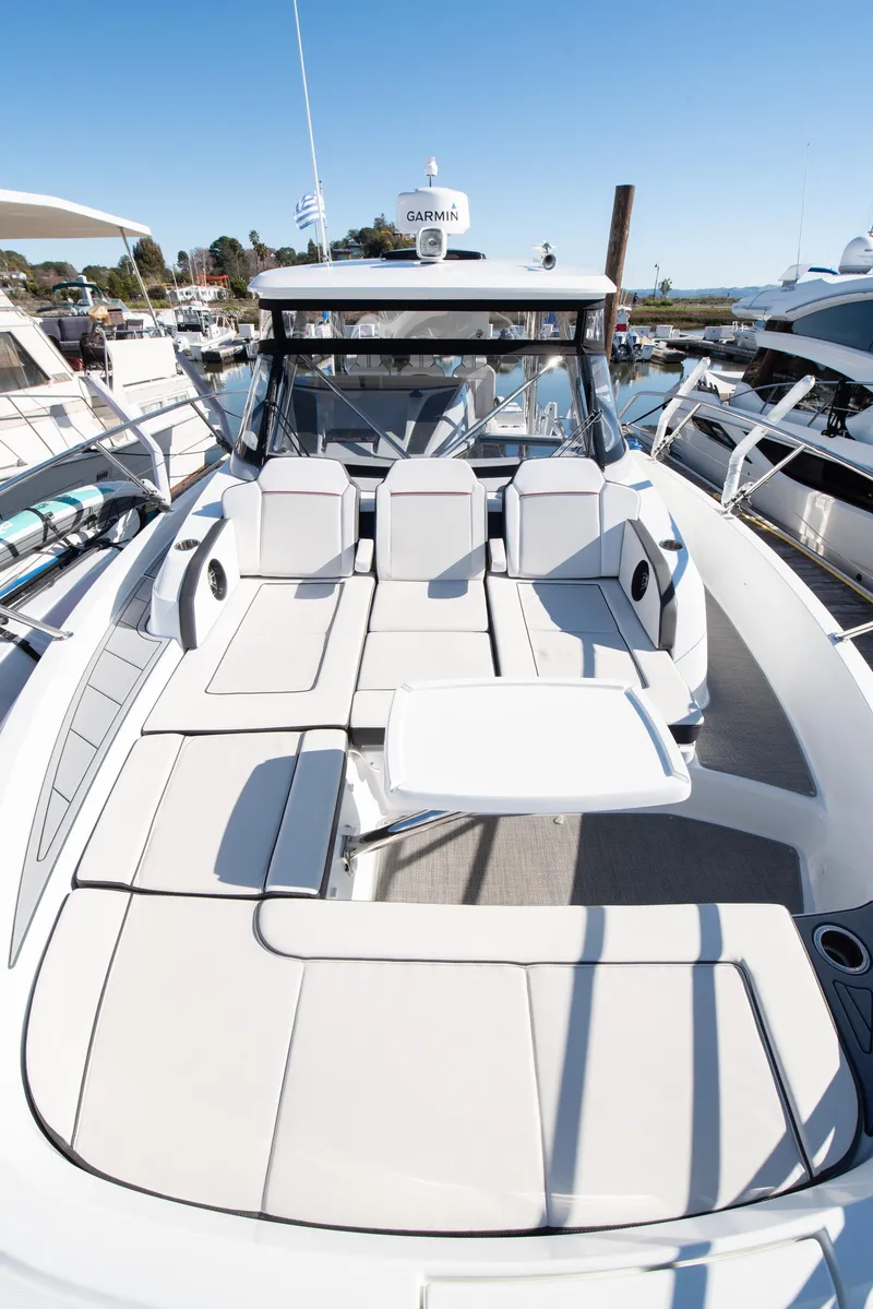Slide: The Image of 2021 Jeanneau Leader 12.5 WA boat with spacious deck and seating area. - 15