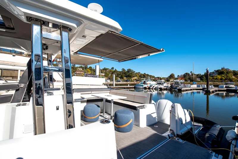 Slide: The Image of 2021 Jeanneau Leader 12.5 WA yacht docked at a marina under clear blue skies. - 17