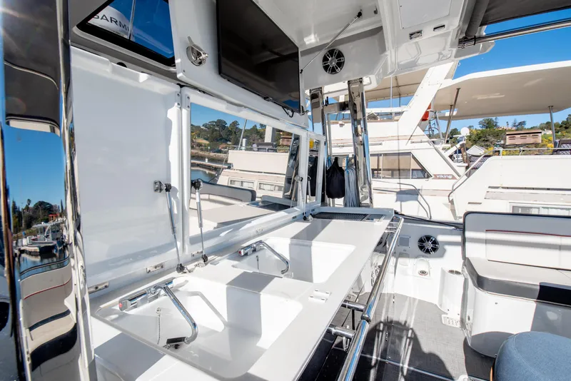 Slide: The Image of 2021 Jeanneau Leader 12.5 WA boat interior with modern amenities and sleek design. - 24