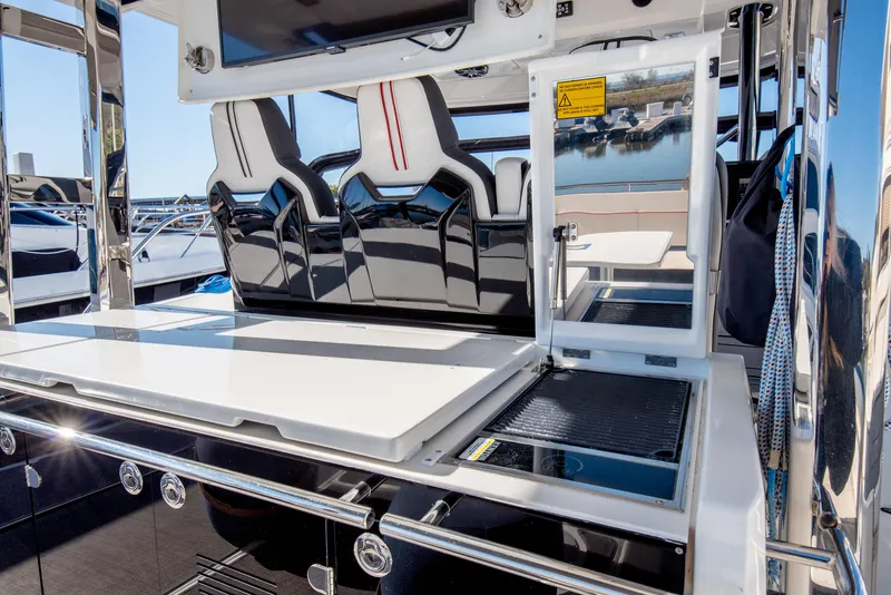 Slide: The Image of 2021 Jeanneau Leader 12.5 WA boat interior with sleek seating and modern design. - 26