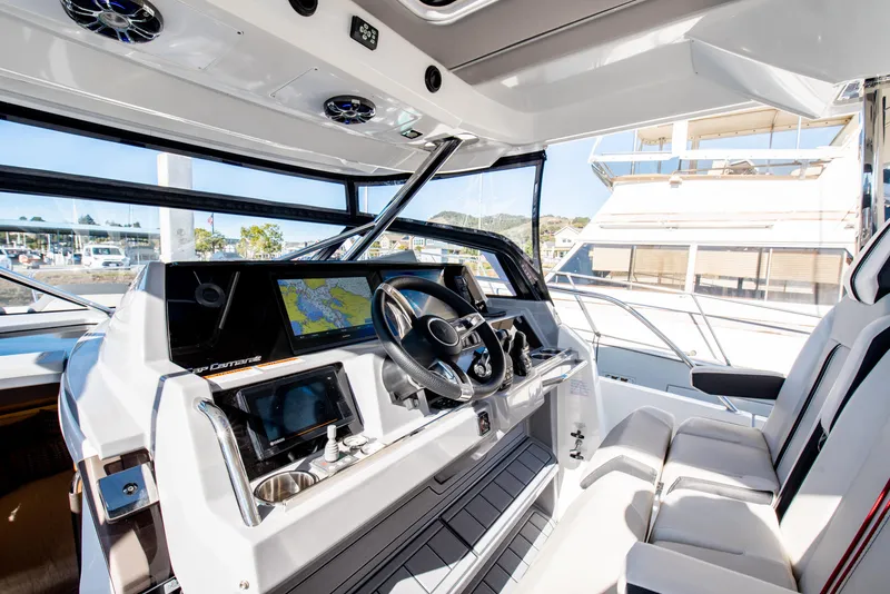 Slide: The Image of 2021 Jeanneau Leader 12.5 WA cockpit with modern navigation system and comfortable seating. - 30