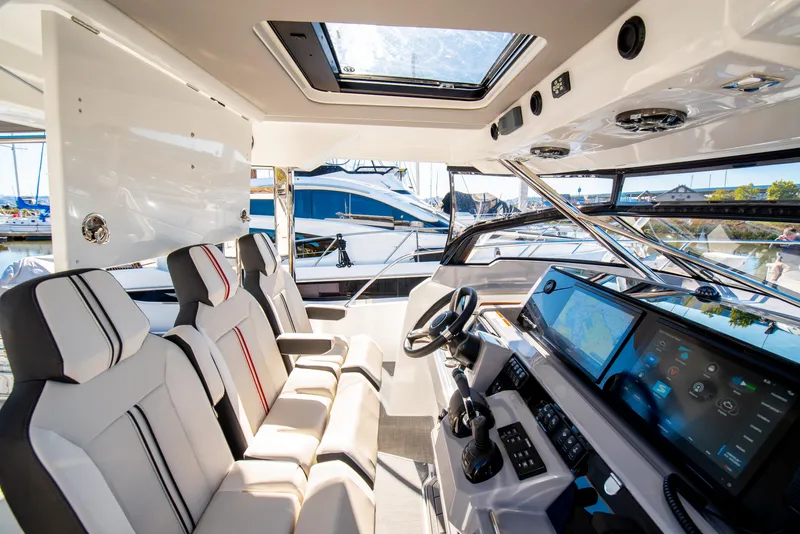 Slide: The Image of Interior of 2021 Jeanneau Leader 12.5 WA boat with modern cockpit and seating. - 33