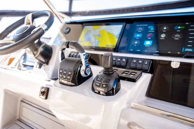 Slide: The Image of 2021 Jeanneau Leader 12.5 WA helm with advanced navigation controls and touchscreen displays. - 35