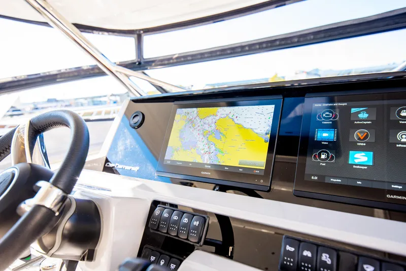 Slide: The Image of Jeanneau Leader 12.5 WA 2021 dashboard with navigation and control screens. - 37