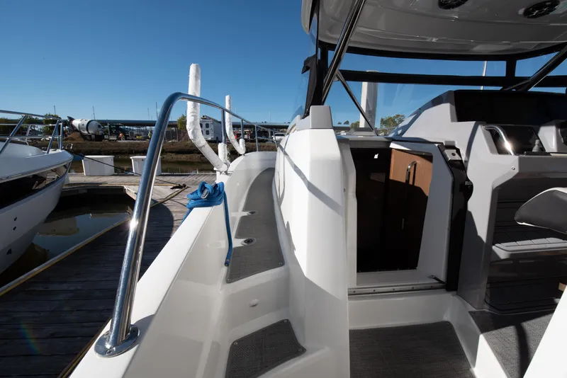Slide: The Image of 2021 Jeanneau Leader 12.5 WA boat docked, showcasing sleek design and modern features. - 38