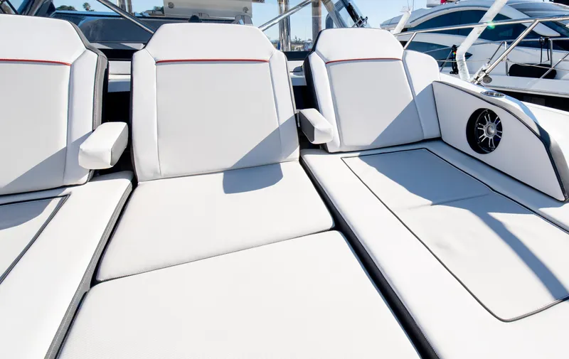 Slide: The Image of Luxurious seating on 2021 Jeanneau Leader 12.5 WA boat, featuring sleek white upholstery. - 43