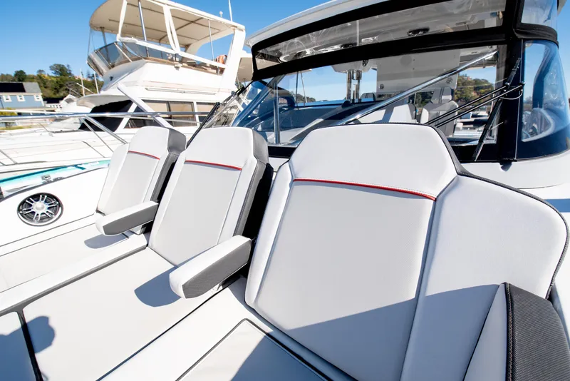 Slide: The Image of 2021 Jeanneau Leader 12.5 WA boat seats, modern design, docked in marina. - 44