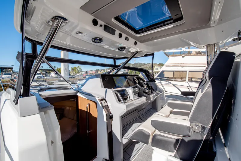 Slide: The Image of 2021 Jeanneau Leader 12.5 WA boat interior with modern cockpit and seating. - 45
