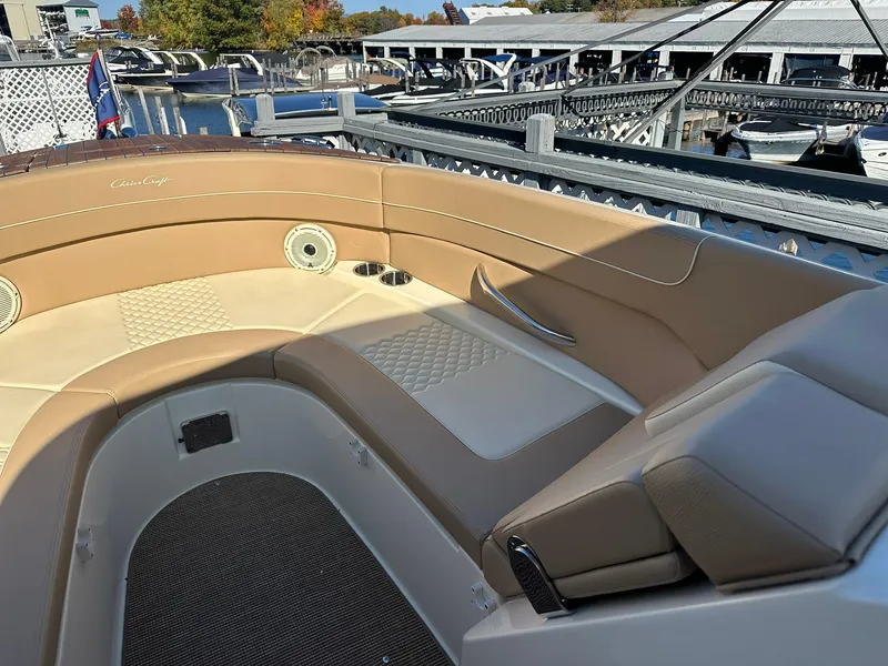 Slide: The Image of 2023 Chris-Craft Launch 28 GT boat interior with tan leather seating. - 14