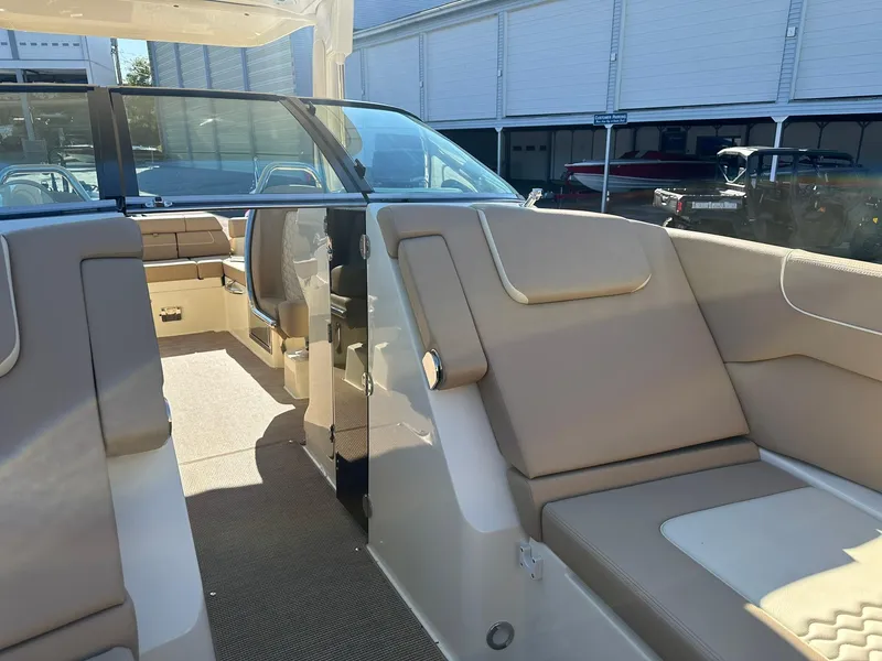 Slide: The Image of 2023 Chris-Craft Launch 28 GT interior with beige seating and sleek design. - 17