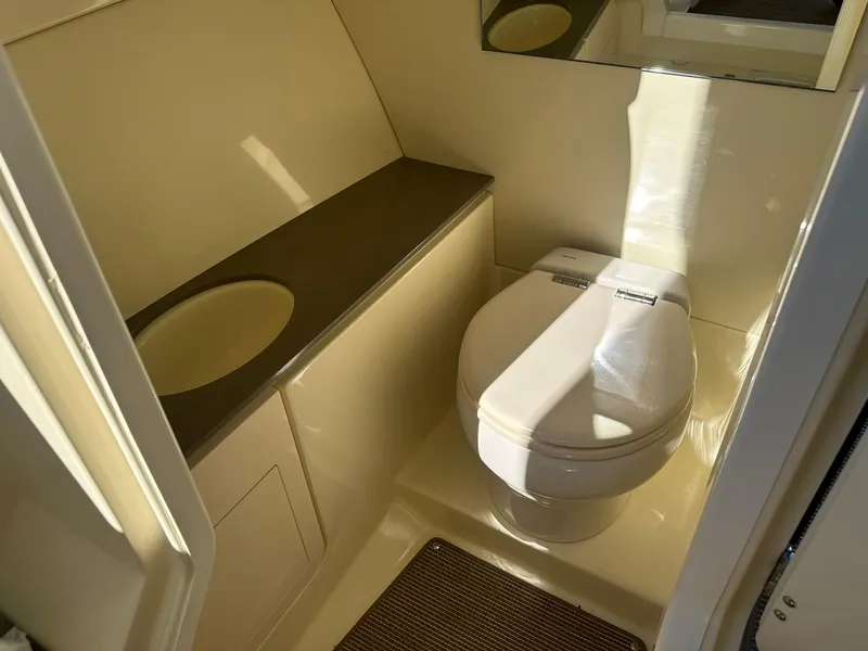 Slide: The Image of Luxurious bathroom in 2023 Chris-Craft Launch 28 GT boat, featuring modern amenities. - 23