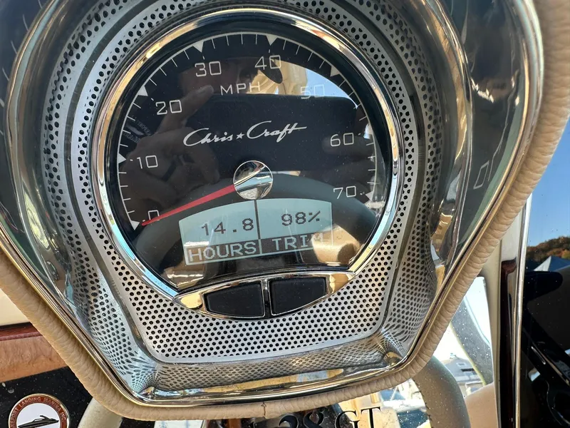 Slide: The Image of Close-up of 2023 Chris-Craft Launch 28 GT speedometer displaying 14.8 hours and 98% trim. - 24
