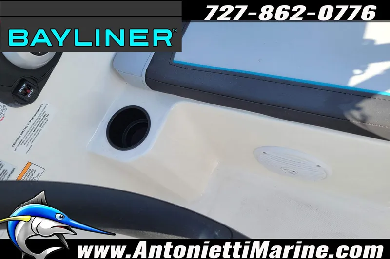 Slide: The Image of 2025 Bayliner Element M17 boat interior with cup holder and speaker, Antonietti Marine branding. - 38