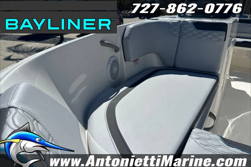 Slide: The Image of 2025 Bayliner Element M17 boat interior with cushioned seating, logo, and contact details. - 48