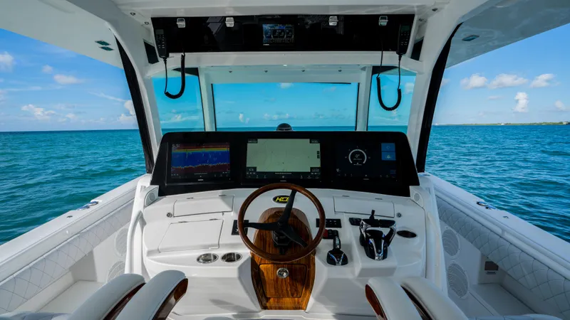 Slide: The Image of 2021 HCB 53 Sueños boat cockpit with ocean view and advanced navigation system. - 10