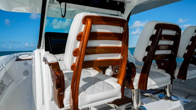 Slide: The Image of Luxury seating on 2021 HCB 53 Sueños boat with ocean view. - 13
