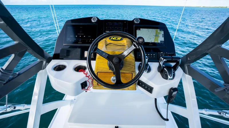 Slide: The Image of Helm of 2021 HCB 53 Sueños boat with ocean view. - 16