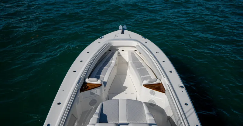Slide: The Image of 2021 HCB 53 Sueños boat bow on calm water. - 17