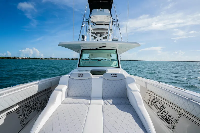 Slide: The Image of Luxury 2021 HCB 53 Sueños boat on open water, clear sky background. - 22