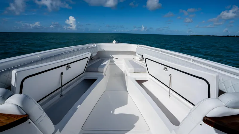 Slide: The Image of 2021 HCB 53 Sueños boat deck with ocean view under blue sky. - 23