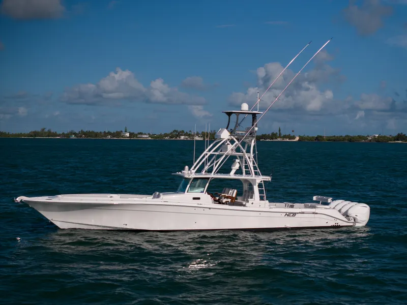 Slide: The Image of 2021 HCB 53 Sueños boat on calm ocean waters under a clear blue sky. - 26