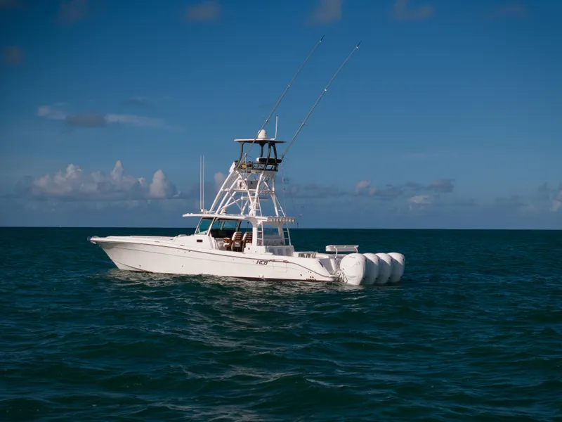 Slide: The Image of 2021 HCB 53 Sueños boat cruising on open sea under clear blue sky. - 27