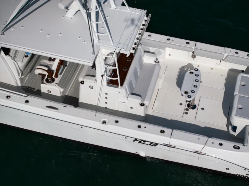 Slide: The Image of 2021 HCB 53 Sueños boat, aerial view, sleek design, spacious deck, white exterior. - 3