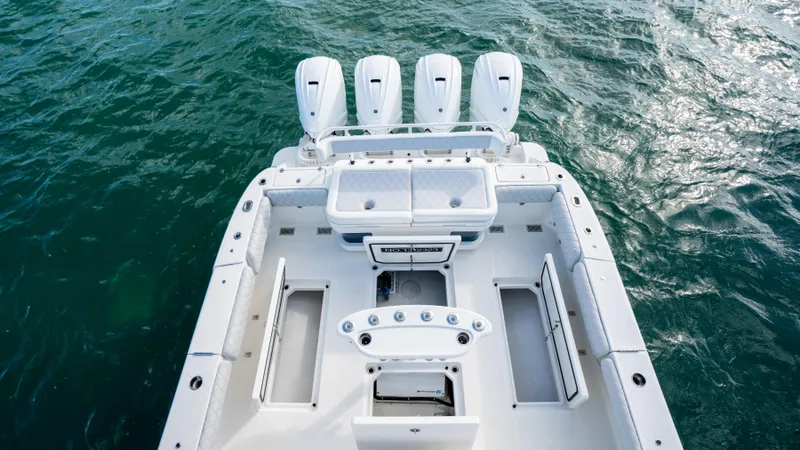 Slide: The Image of 2021 HCB 53 Sueños boat with four engines on open water. - 5