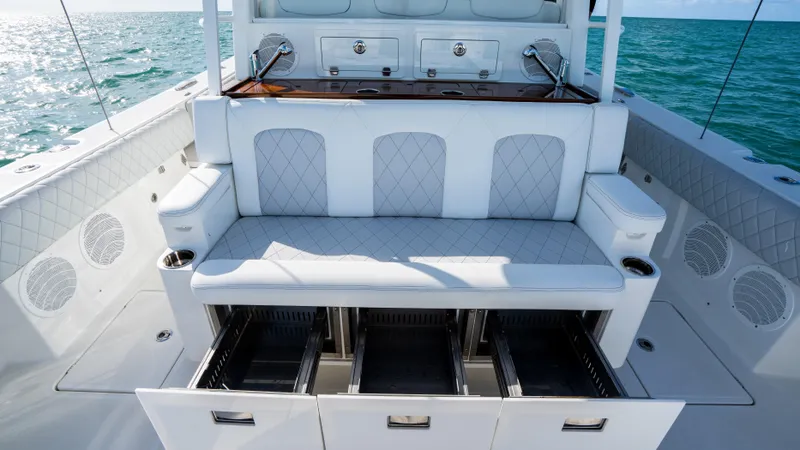 Slide: The Image of Luxurious seating on 2021 HCB 53 Sueños boat with ocean backdrop. - 8