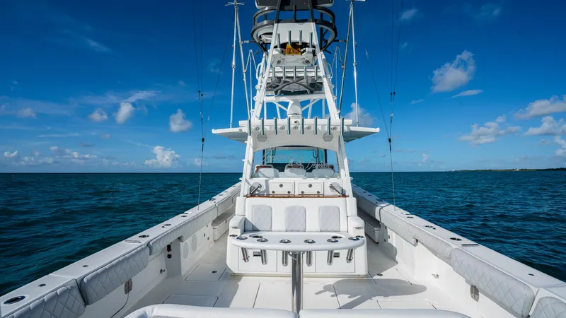 Slide: The Image of 2021 HCB 53 Sueños boat on open sea under clear blue sky. - 9