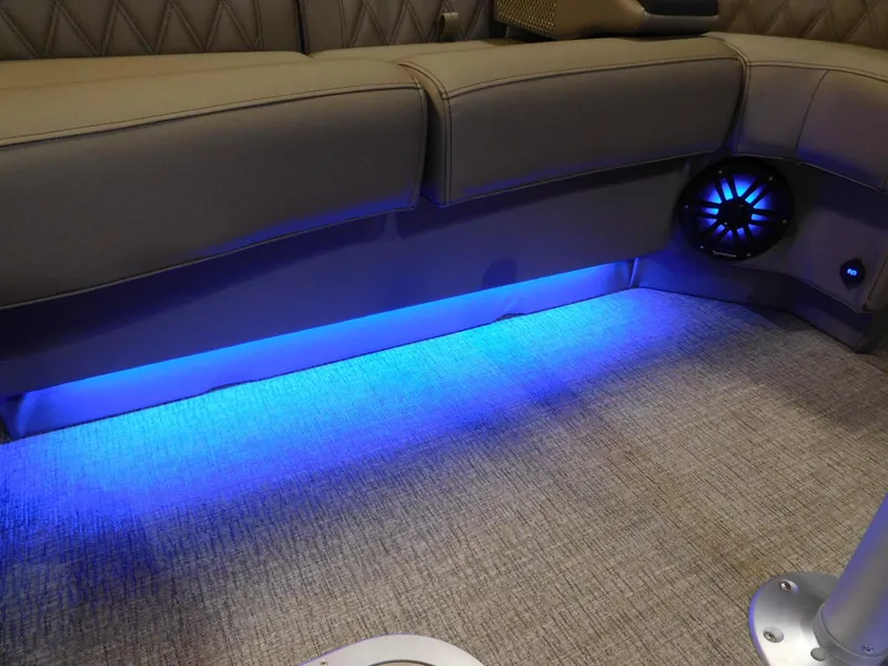 Slide: The Image of 2025 Bennington 25 QFB interior with blue LED lighting and speaker detail. - 10