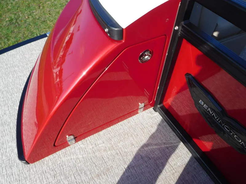 Slide: The Image of 2025 Bennington 25 QFB boat, red exterior detail, sleek design. - 11