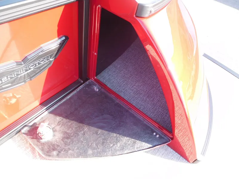 Slide: The Image of 2025 Bennington 25 QFB boat, red exterior detail with logo. - 13