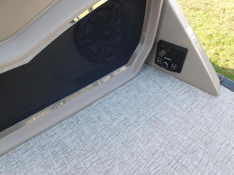 Slide: The Image of Interior view of 2025 Bennington 25 QFB boat with speaker and control panel. - 14