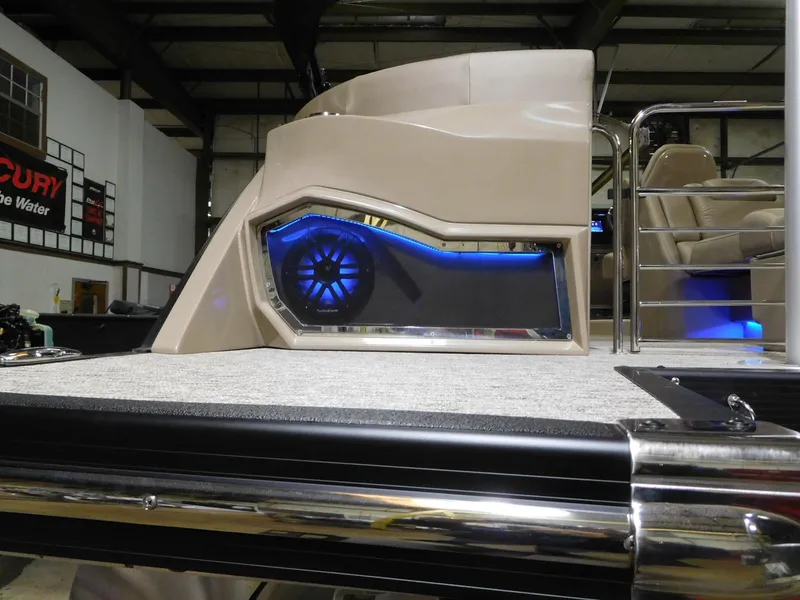 Slide: The Image of 2025 Bennington 25 QFB boat interior with illuminated speaker and modern design. - 15