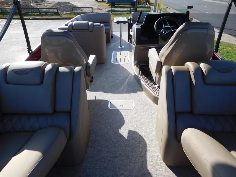 Slide: The Image of Luxurious interior of 2025 Bennington 25 QFB pontoon boat with plush seating. - 16