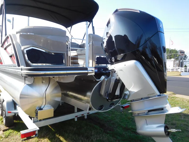 Slide: The Image of 2025 Bennington 25 QFB pontoon boat with powerful outboard motor. - 18