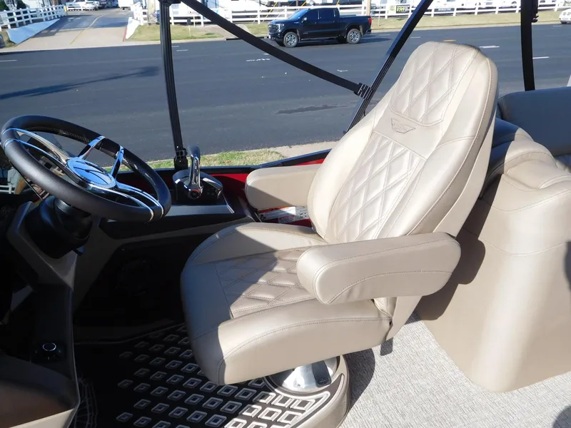 Slide: The Image of Luxurious captain's chair in 2025 Bennington 25 QFB boat cockpit. - 5