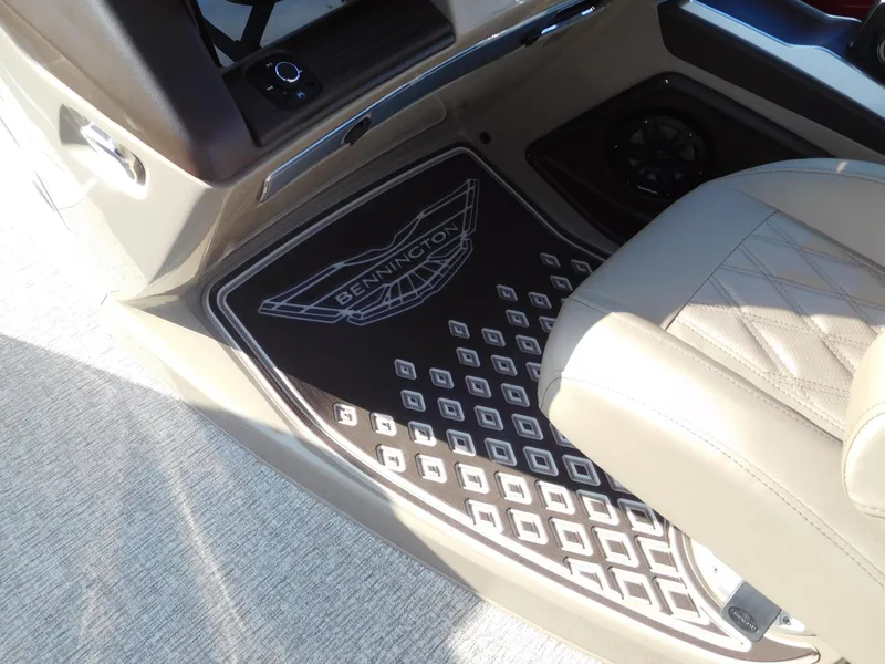 Slide: The Image of Bennington 25 QFB 2025 boat interior with custom floor mat and seating. - 6