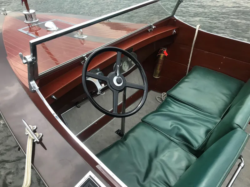 Slide: The Image of 1930 Chris-Craft Triple cockpit with green leather seats and wooden dashboard. - 11
