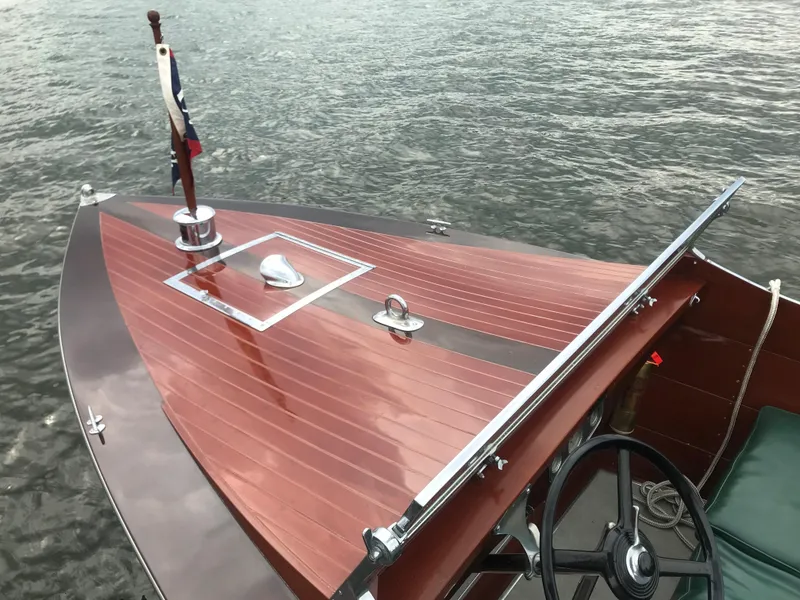 Slide: The Image of 1930 Chris-Craft Triple wooden boat on water, polished deck, classic design. - 12
