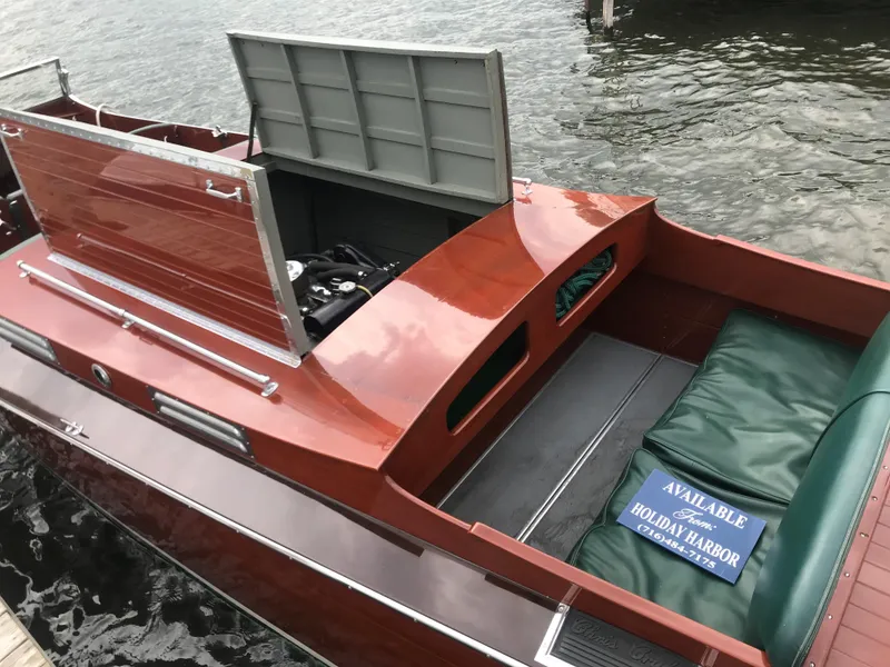 Slide: The Image of 1930 Chris-Craft Triple boat with open engine compartment docked at Holiday Harbor. - 13