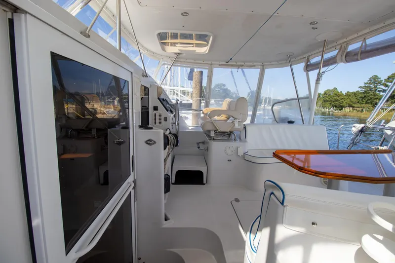 Slide: The Image of Spacious cockpit of 2004 Antares PDQ 44 yacht with modern navigation equipment. - 16