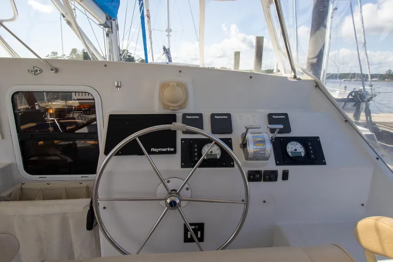 Slide: The Image of Helm of 2004 Antares PDQ 44 yacht with steering wheel and navigation instruments. - 17