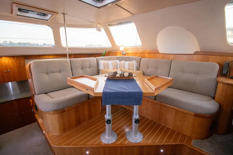 Slide: The Image of Luxurious interior of 2004 Antares PDQ 44 yacht with elegant seating and wooden accents. - 27